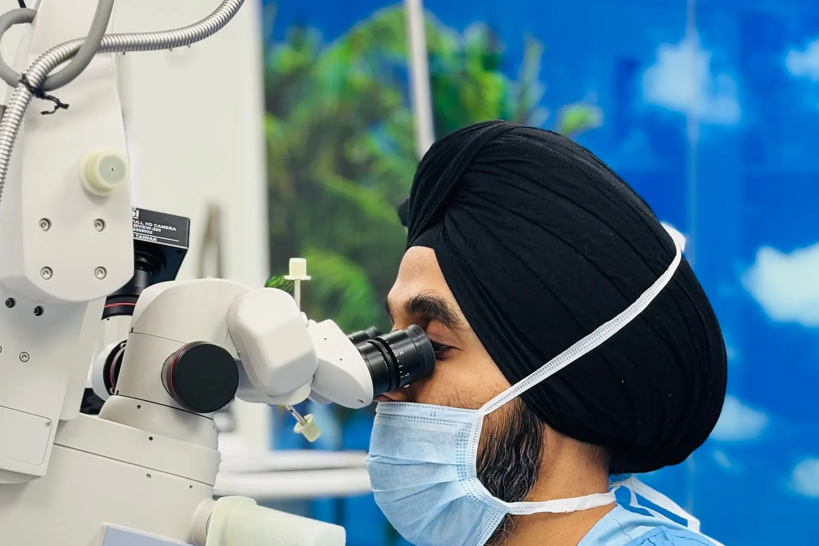 Eye surgeon at the laser microscope during a procedure
