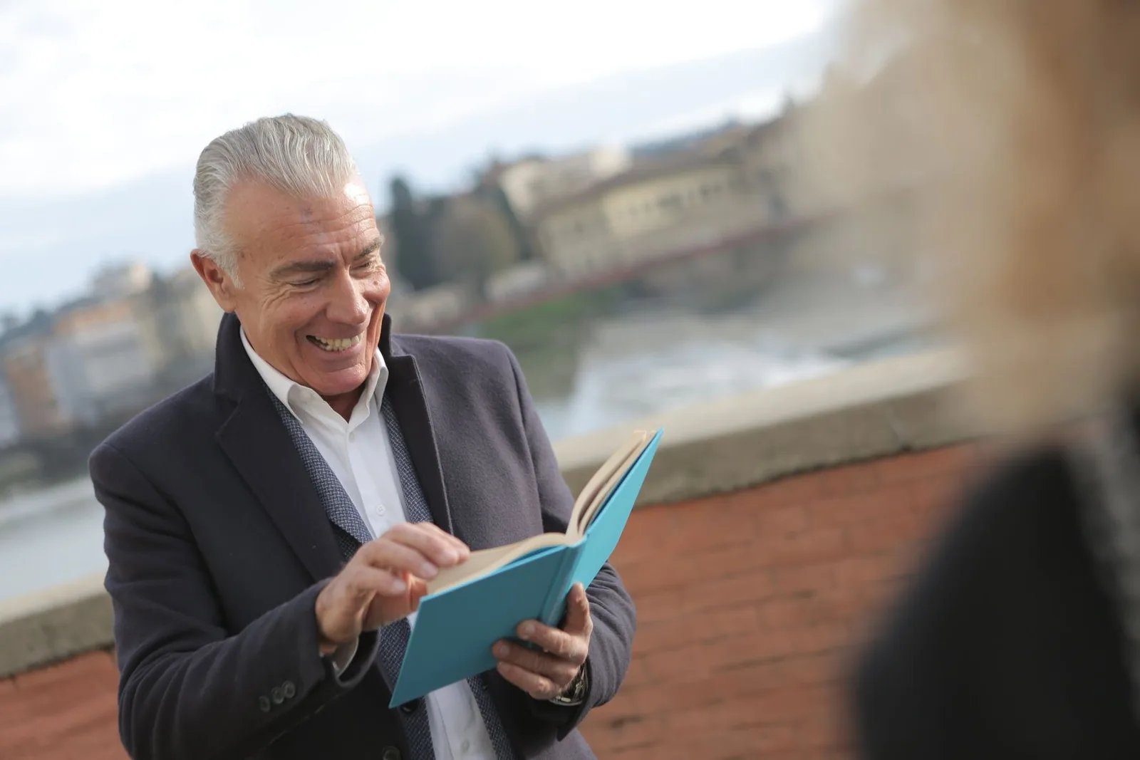 Man in his sixties reading comfortably without glasses